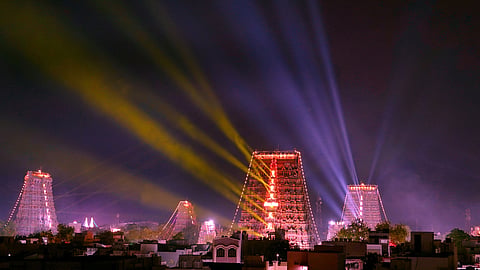 Bathed in laser light, the gopurams of the Meenakshi Sundareswarar temple dazzle in Wednesday’s night sky.