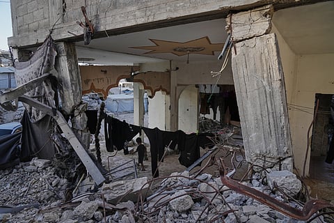 Displaced Palestinians shelter inside a building heavily damaged during the Israel-Hamas war in Gaza City, Thursday, Sept. 17, 2026.