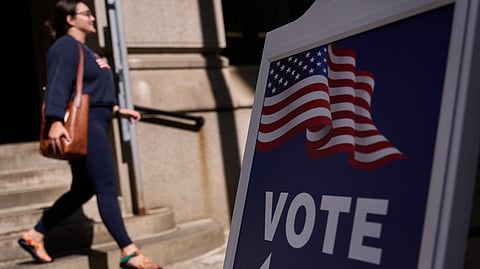 A sign directs voters to an entrance for City Hall during early voting for the Rhode Island primary election, Wednesday, Sept. 2, 2026, in Providence, R.I.