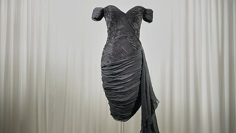 A dress worn by the late Princess Diana and known as the ''Revenge Dress'', designed by Christina Stambolian, is unveiled at Sotheby’s auction house in London, Friday, Sept. 18, 2026, ahead of its Dec. 9 auction in New York, where it is estimated to sell for US$150,000-300,000.