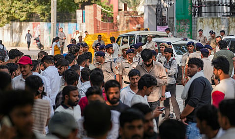 Police personnel stand guard amid the counting of votes for the Delhi University Students' Union (DUSU) elections, at North Campus, in New Delhi, Saturday, Sept. 19, 2026.