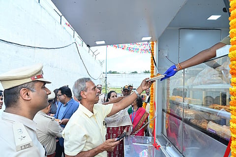 Alok Kumar, DGP, Prisons and Correctional Services, buys a pastry from the bakery-on-wheels facility