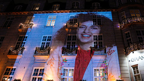 A photo of Nobel Peace Prize recipient Narges Mohammadi is projected onto the wall of the Grand Hotel in central Oslo before the Nobel banquet on Dec. 10, 2023.