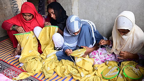Women artisans embroidering fabrics in Lucknow