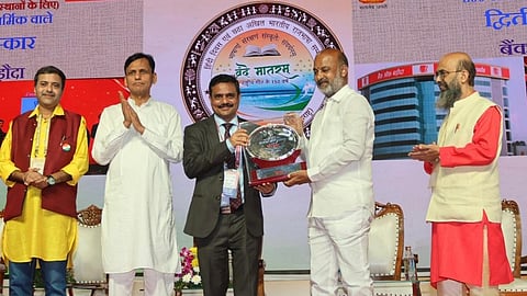 Dr. Debadatta Chand receives Rajbhasha prize from MoS Bandi Sanjay Kumar.
