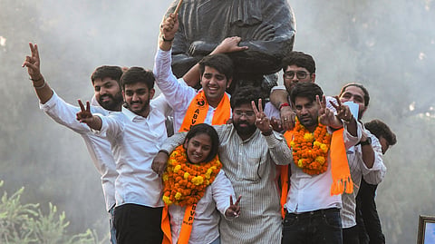 Akhil Bharatiya Vidyarthi Parishad (ABVP) winners Yash Dabas, Riya Chhawadi, and Lakshya Raj Singh celebrate as they win the President, Secretary, and Joint Secretary posts, respectively, in the Delhi University Students’ Union (DUSU) polls in New Delhi on Saturday, Sept. 19, 2026.