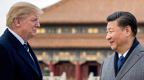 President Donald Trump, left, and Chinese President Xi Jinping tour the Forbidden City, Nov. 8, 2017, in Beijing, China