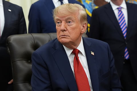 President Donald Trump listens to a question from a reporter during an event about healthcare in the Oval Office of the White House, Friday Sept. 18, 2026, in Washington.