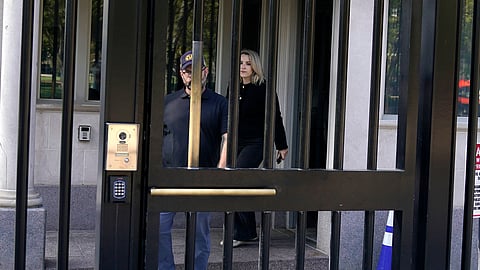 CNN Senior White House Reporter Betsy Klein, right, departs after having her credential revoked following President Donald Trump's ban on CNN, MS NOW and Politico at the White House, Saturday, Sept. 19, 2026, in Washington.