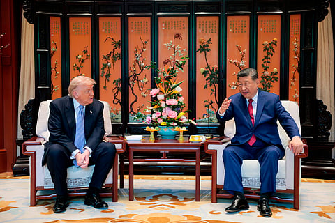 Chinese President Xi Jinping, right, speaks during a meeting with President Donald Trump on the sidelines of their visit to the Zhongnanhai Garden in Beijing, China, May 15, 2026.