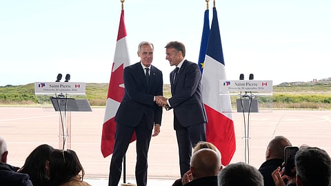 French President Emmanuel Macron, left, and Canadian Prime Minister Mark Carney shake hands after delivering remarks in Saint-Pierre, Saint-Pierre-et-Miquelon, Sunday, Sept.20, 2026.
