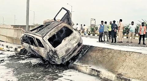 Bystanders look on as police inspect the accident spot near Pillalamarri village in Suryapet on Sunday.