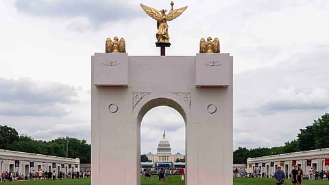 A mockup of President Donald Trump's proposed triumphal arch stands at the Great American State Fair on the National Mall, June 27, 2026, in Washington.