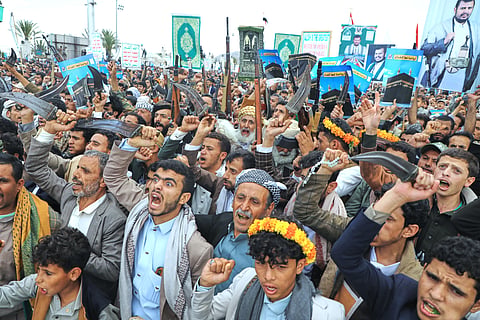 Supporters of Yemen's Houthi rebels raise their rifles during a rally in support of the group and to protest Saudi Arabia's accusation that the Houthis targeted Islam's holiest site of Mecca, in Sanaa, Yemen, Friday, Sept. 18, 2026.