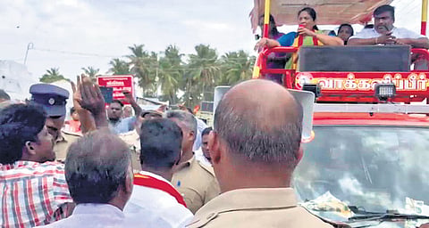 Farmers staging a protest against TVK bypoll candidate P Sathyabama during her campaigning in Dharapuram of Tiruppur on Sunday
