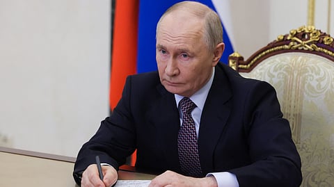 In this pool photograph distributed by the Russian state agency Sputnik, Russia's President Vladimir Putin chairs a Security Council meeting via videolink in Moscow on May 8, 2026.