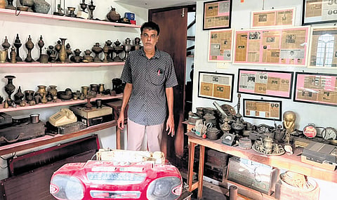 Abdul Ali with the antique collections at his home