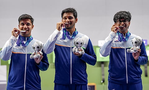 (from left) India's Himanshu Dhillon, Rudrankksh Patil and Parth Mane after wiining silver medal in the 10 metre rifle men team event in the ongoing Asian Games on Monday