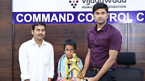 Vijayawada Municipal Corporation Commissioner Dhyanachandra on Monday felicitated a father-son duo
