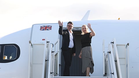 Britain's Prime Minister Andy Burnham and his wife, Marie-France van Heel, board a plane for the United States at Stansted Airport, Stansted, England, Monday, Sept. 21, 2026, to attend the UN General Assembly in New York.