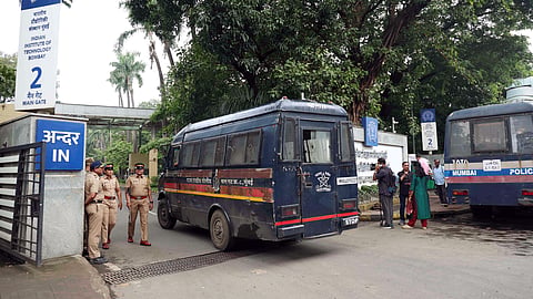 Police personnel stand guard outside the Indian Institute of Technology (IIT) Bombay Main Gate as students stage a protest following the tragic death of a 22-year-old student, in Mumbai on Saturday.