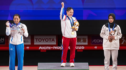 North Korea's gold medallist Ri Song Gum, (centre) joined an elite club of just four weightlifters who have won three Asian Games gold medals.