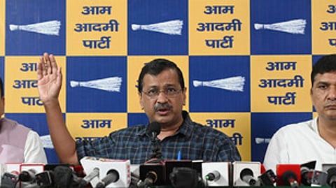Former Delhi chief minister and Aam Aadmi Party (AAP) chief Arvind Kejriwal (C) party MP Sanjay Singh (L) and the party's Delhi chief Saurabh Bharadwaj (R).