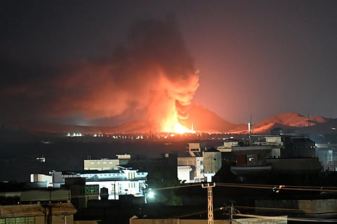 Flames and smoke rise from an area struck by an airstrike in Kandahar on September 24, 2026.
