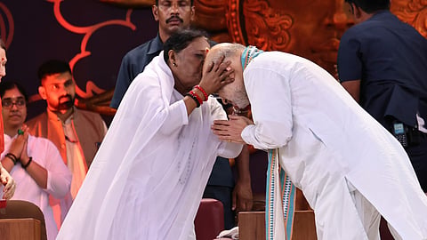 Shah with Mata Amritanandamayi at Amritapuri in Kollam on Saturday.