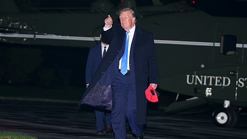 US President Donald Trump walks on the South Lawn of the White House after arriving on Marine One, Sunday, Sept. 27, 2026, in Washington.