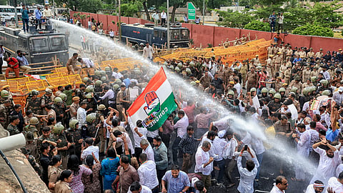 Police use water cannon to disperse Congress workers during a protest against Chief Election Commissioner Gyanesh Kumar over irregularities in the Special Intensive Revision (SIR) of electoral rolls, in Jaipur, Monday, Sept. 28, 2026.