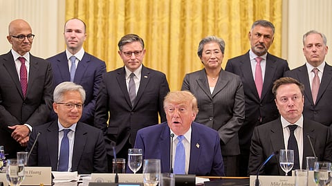 US President Donald Trump, center, next to Nvidia CEO Jensen Huang, left, and Elon Musk, right, speaks in the East Room of the White House in Washington, Tuesday, Sept. 29, 2026, surrounded by top executives of AI firms including, from top left, Microsoft CEO Satya Nadella, Greg Brockman, President of OpenAI, House Speaker Mike Johnson, AMD CEO Lisa Su, Palo Alto Networks Chief Executive Nikesh Arora, and David Sacks.