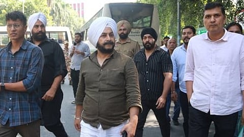AAP leaders Saurabh Bhardwaj (right) and Jarnail Singh (centre).