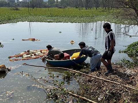 Volunteers at work removing festival waste from Halanayak-anahalli Lake near Sarjapur Road