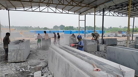 Craftsmen at the Purushothapatnam workshop in Andhra Pradesh shape black granite blocks into pillars and doorways for the Bhadrachalam temple revamp.