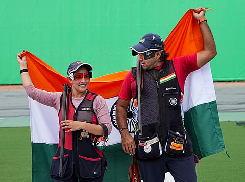 Neeru Dhanda and Kynan Chenai after winning the trap mixed team gold on Wednesday