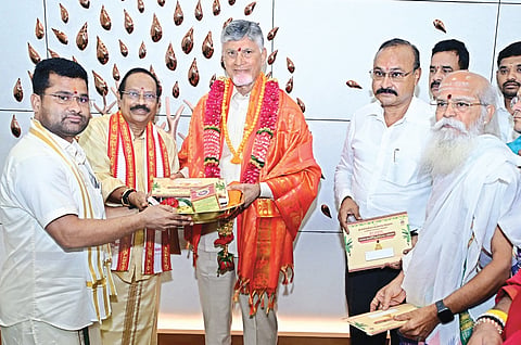 SDMSD EO VK Seena Naik, board chairman Borra Radha Krishna, endowments department commissioner Ramachandra Mohan and priests of Kanaka Durga temple invite CM Nara Chandrababu Naidu to the dussehra festivities on Wednesday.