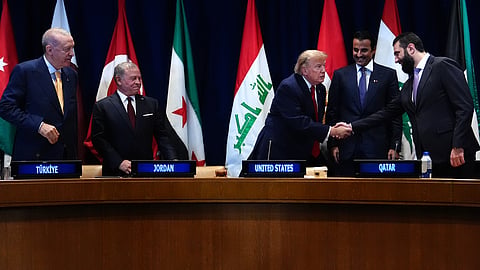 President Donald Trump shakes hands with Syria's President Ahmed al-Sharaa as Turkey's President Recep Tayyip Erdogan, from left, Jordan's King Abdullah II, and Qatar's Emir Sheikh Tamim bin Hamad Al Thani, at a multilateral meeting with the Gulf Cooperation Council during the United Nations General Assembly, Tuesday, Sept. 22, 2026, at the UN headquarters.