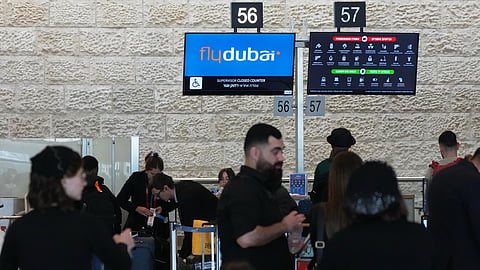 Passengers check in their luggage with FlyDubai at Ben Gurion International Airport, near Tel Aviv, Israel, Wednesday, Sept. 30, 2026.