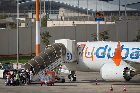 Passengers embark on a FlyDubai aircraft at Ben Gurion International Airport, near Tel Aviv, Israel, Wednesday, Sept. 30, 2026.