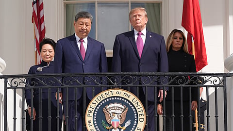 US President Donald Trump, front right, first lady Melania Trump, background right, China's President Xi Jinping, front left, and his wife Peng Liyuan arrive to watch a silent drill platoon review on the new helipad from the Blue Room Balcony of the White House, Thursday, Sept. 24, 2026, in Washington.