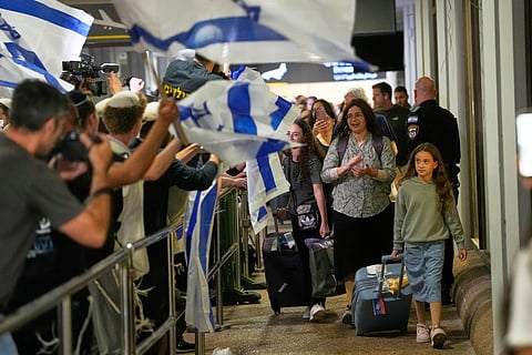 Israeli passengers who had been aboard a FlyDubai aircraft that made an emergency landing in Saudi Arabia are welcomed at the arrivals gate at Ben Gurion International Airport near Tel Aviv, Israel, Wednesday, Sept. 30, 2026.