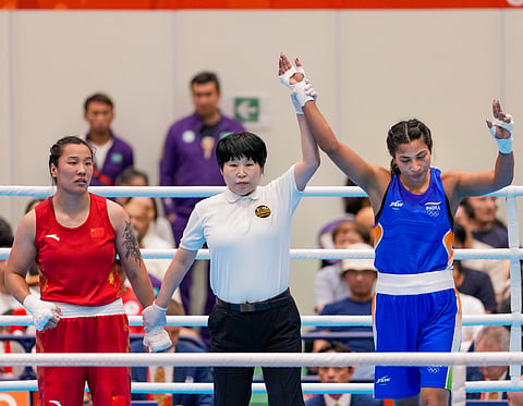 Lovlina Borgohain's hand being raised by the referee on Friday