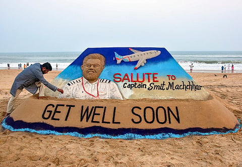 Sand artist Sudarsan Pattnaik creates sand art of Capt Smit Machchhar at Puri.