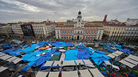 Activists camp during a protest following the eviction of 87-year-old Maricarmen last Wednesday to demand stronger laws to protect renters at Sol Square in Madrid, Spain, Wednesday, Sept. 30, 2026.