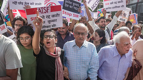 All India Students' Association (AISA) National President Neha Bora, with advocates Kapil Sibal and Prashant Bhushan, and others, during a protest organised by various student bodies demanding the resignation of Chief Election Commissioner (CEC) Gyanesh Kumar over alleged irregularities in electoral rolls, near Jantar Mantar, in New Delhi, Saturday, Oct. 3, 2026.