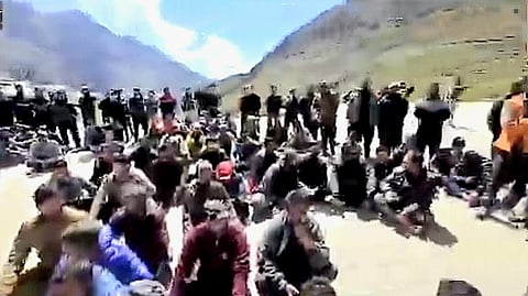 A large group of traders gathered at the helipad after an administrative team, accompanied by police, began clearing the roadside stalls.