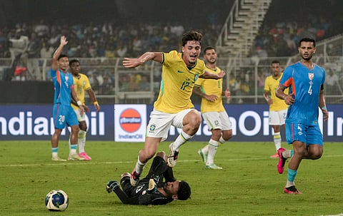 Action from the friendly match between Brazil and India at the Salt Lake Stadium in Kolkata on Saturday