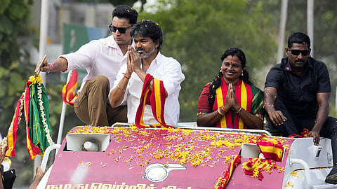 Tamil Nadu Chief Minister and TVK President C Joseph Vijay greets the crowd during a roadshow in the Madurantakam constituency ahead of the upcoming assembly bypolls on October 6, in Chennai on Friday, Oct. 02, 2026.