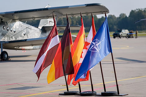 The flags of Latvia, Germany, Spain, Canada and NATO are seen during the NATO Media Day at the Lielvarde Air Base in Lielvarde, Latvia, on October 1, 2026, ahead of the country's parliamentary elections.
